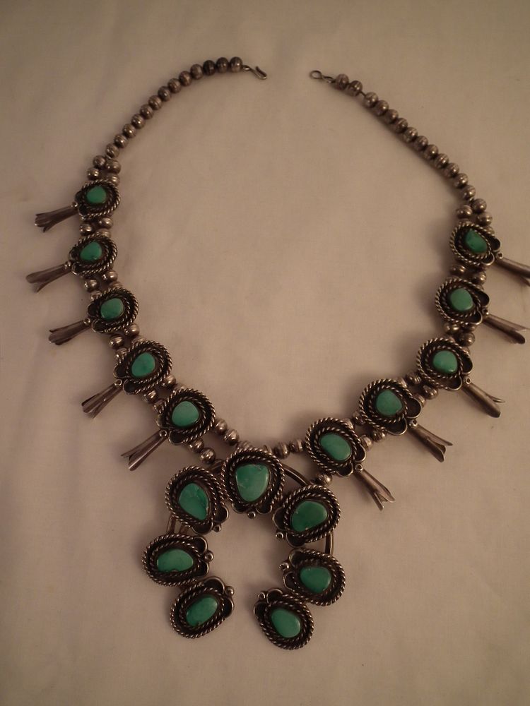 Appraisal: NAVAJO SILVER SQUASH BLOSSOM NECKLACE Navajo pawn sterling silver squash