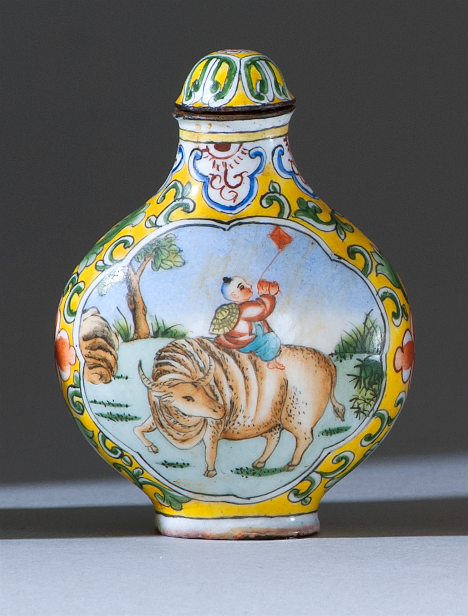 Appraisal: PAINTED ENAMEL SNUFF BOTTLE th CenturyIn pear shape with herdboy