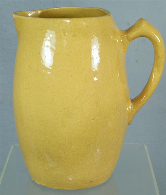 Appraisal: Yellowware pitcher bulbous body h flake on spout Estimate -