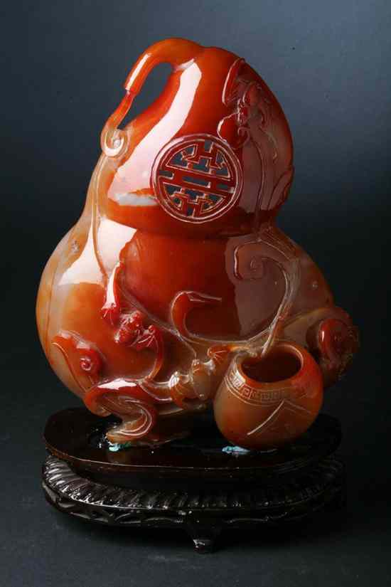 Appraisal: CHINESE CARNELIAN DOUBLE GOURD WALL VASE Signed carved with ruyi