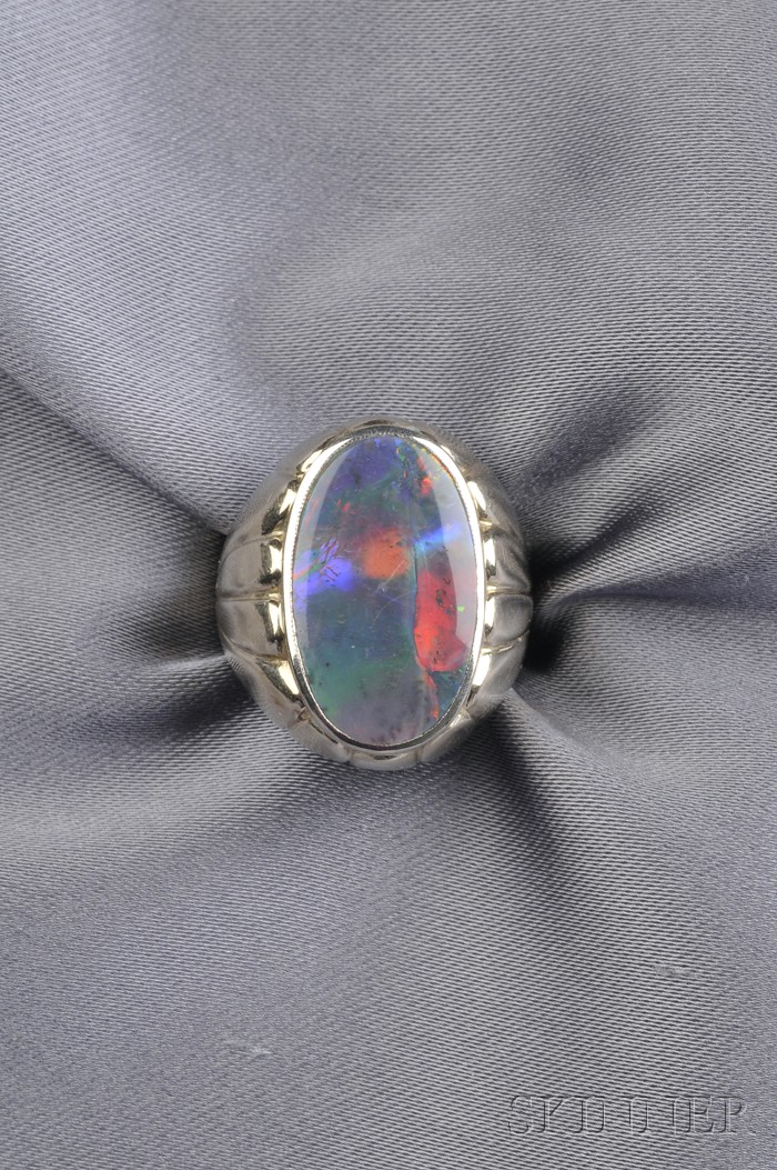 Appraisal: Black Opal Ring bezel-set with a tablet measuring approx x