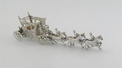 Appraisal: A continental miniature coach being drawn by six horses with