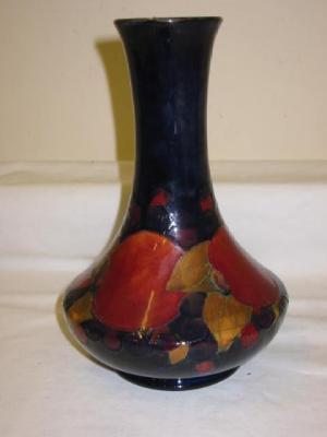 Appraisal: A WALTER MOORCROFT POTTERY VASE of bottle form tube lined