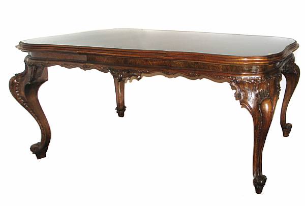 Appraisal: A Continental Rococo style walnut dining table height in width