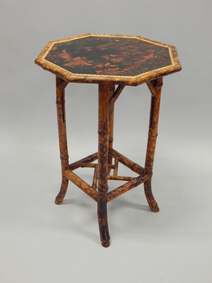 Appraisal: A Victorian bamboo occasional table the octagonal top inset with