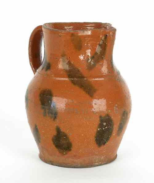 Appraisal: Pennsylvania redware pitcher th c with manganese slip decoration h