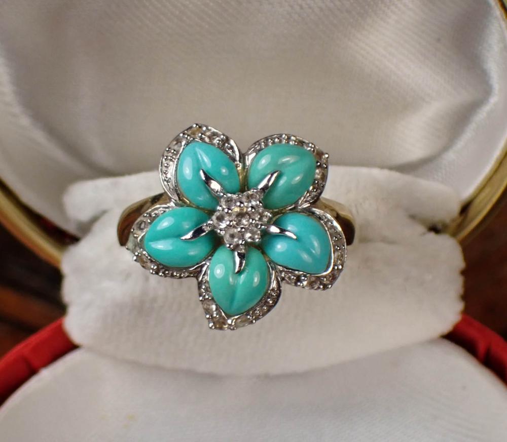 Appraisal: TURQUOISE AND FOURTEEN KARAT TWO-TONE GOLD RING The k yellow