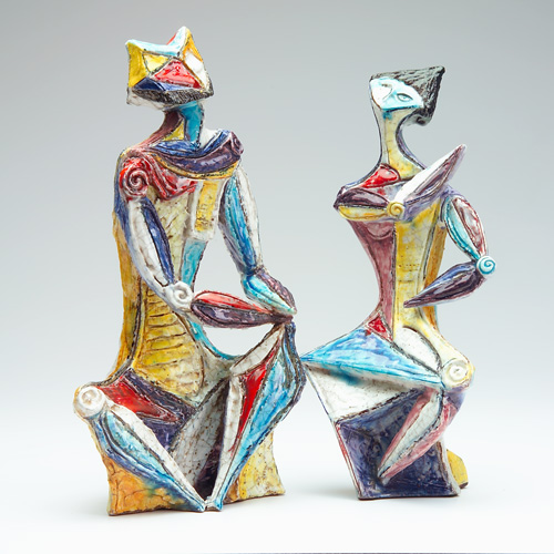 Appraisal: FANTONI Pair of faience figures depicting Venetian revellers in the