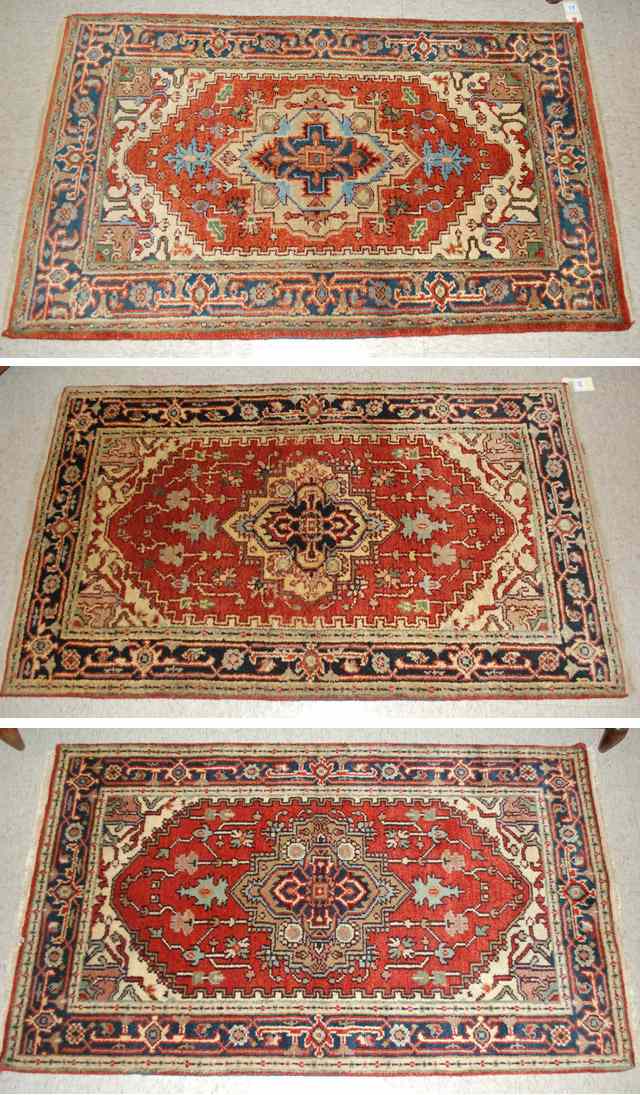 Appraisal: THREE HAND KNOTTED ORIENTAL AREA RUGS Persian Serapi design each