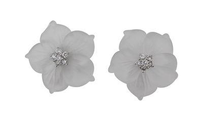 Appraisal: A pair of carved rock crystal and diamond set flower