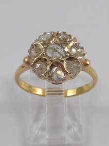 Appraisal: A yellow metal tests ct gold rose cut diamond cluster