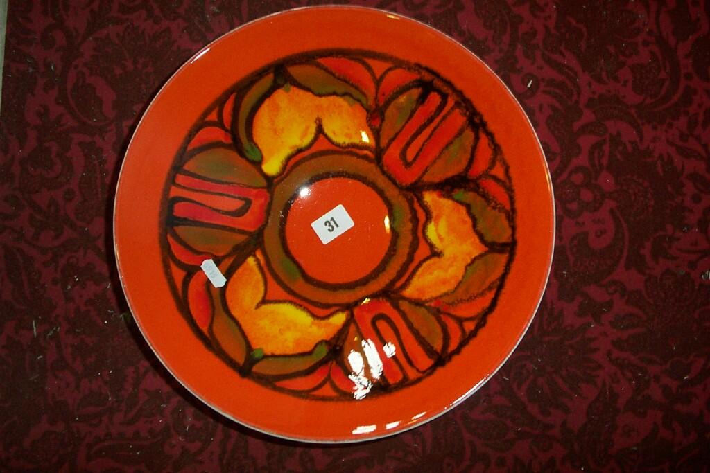 Appraisal: A large orange ground Poole pottery bowl with painted abstract