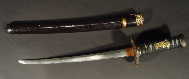 Appraisal: Japanese Meji period short sword with black lacquered scabbard shagreen