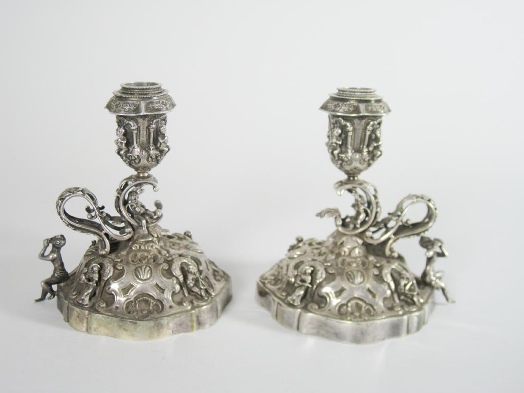 Appraisal: Pair of th Century Continental Candlesticks with applied figures of