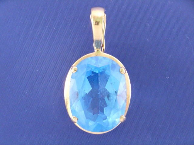 Appraisal: A ct gold blue topaz enhancer gms