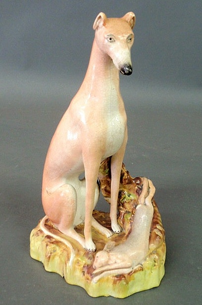 Appraisal: Large Staffordshire seated whippet with rabbit h