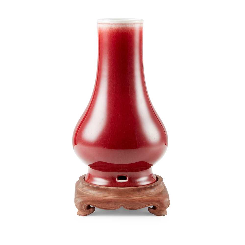 Appraisal: RED-GLAZED PEAR-SHAPED VASE QIANLONG MARK the slightly compressed globular body