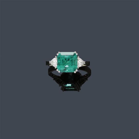 Appraisal: EMERALD AND DIAMOND RING White gold Classic-elegant ring the top