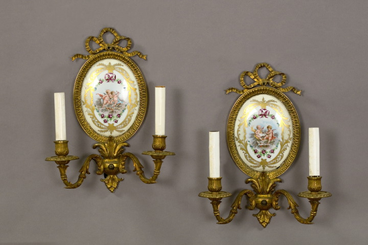 Appraisal: Pair of French Gilt-Brass-Mounted Porcelain Oval Plaques second quarter th