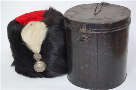 Appraisal: An Artillery busby the bear skin busby with red felt