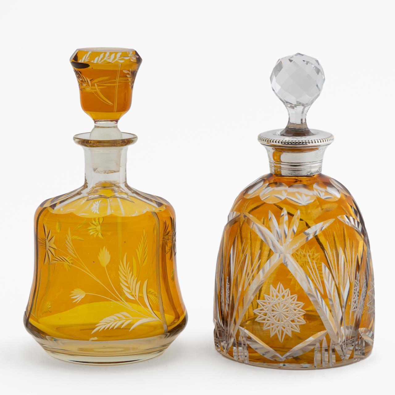 Appraisal: TWO BOHEMIAN AMBER CUT-TO-CLEAR DECANTERS Czechoslovakian th century group of