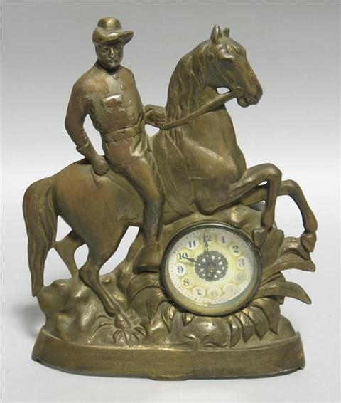 Appraisal: TEDDY ROOSEVELT ROUGH RIDER PATINATED METAL CLOCK The bronze facade