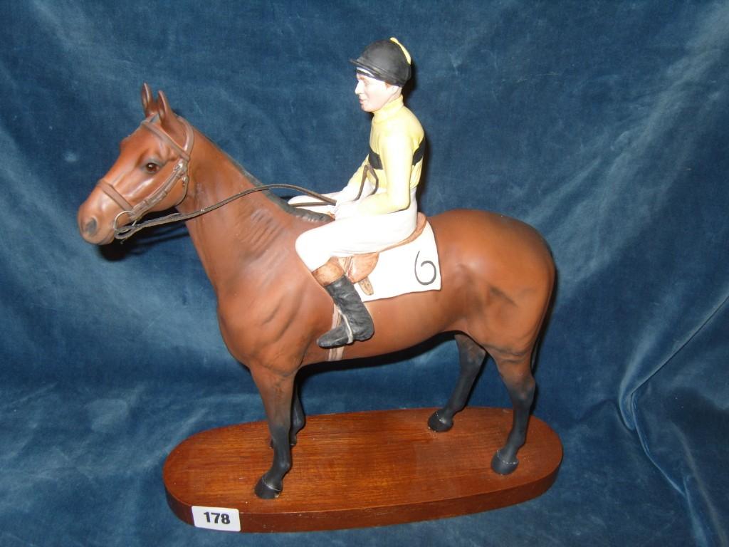 Appraisal: A Beswick matt glazed model of Arkle with Pat Taaffe