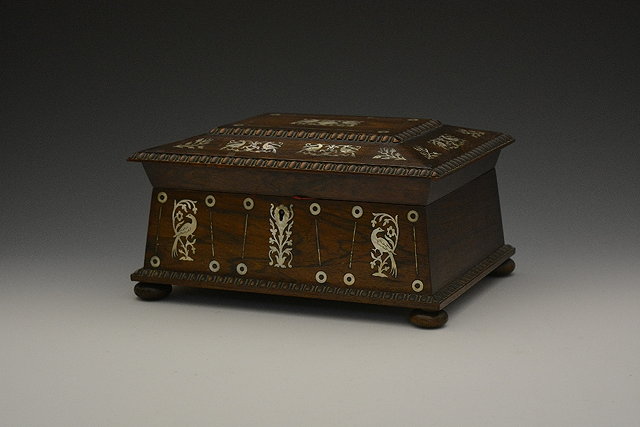 Appraisal: A Victorian rosewood sewing boxwith domed lid having inlaid mother