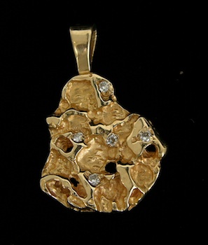 Appraisal: A Diamond and Gold Nugget Pendant k yellow gold nugget