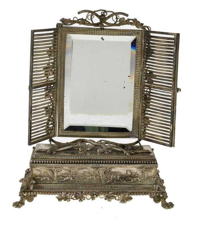 Appraisal: A PALAIS ROYAL SILVERED BRASS DRESSING MIRROR framed by grapevines