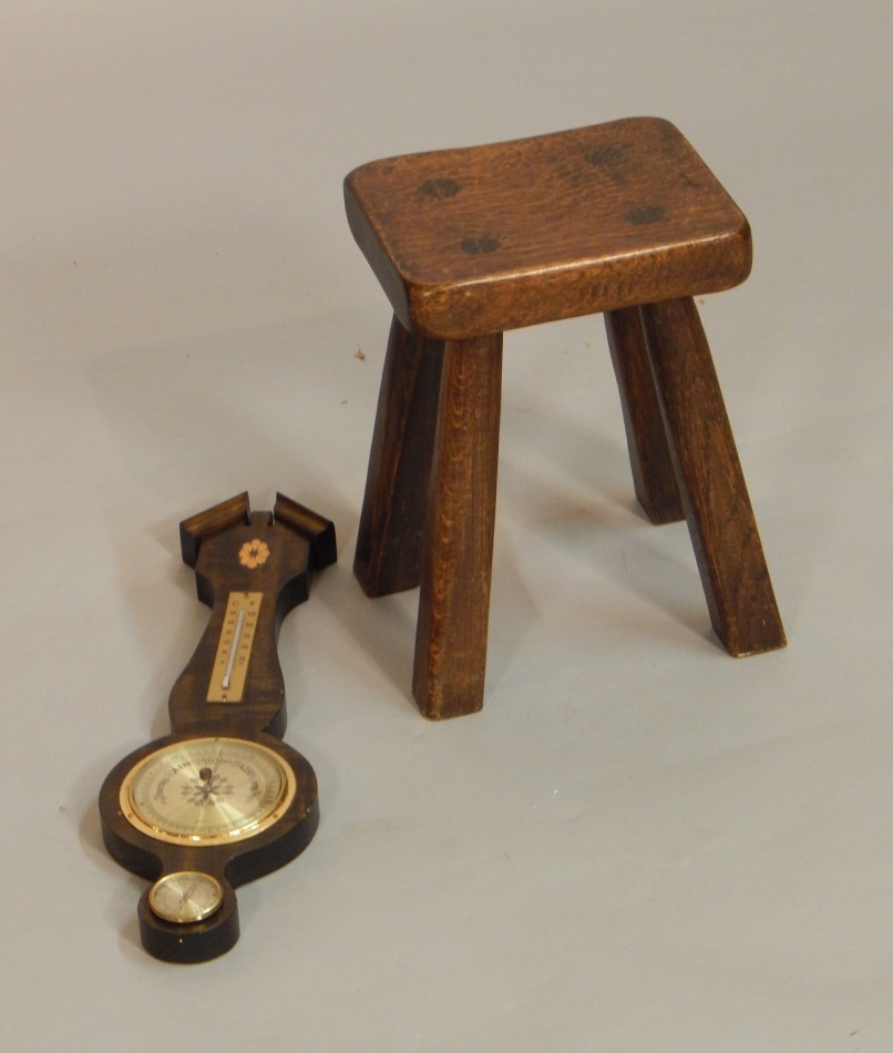 Appraisal: An oak four legged stool with a rectangular adzed top