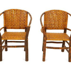 Appraisal: A Pair of Naturalistic Wood and Rattan Barrel Back Armchairs