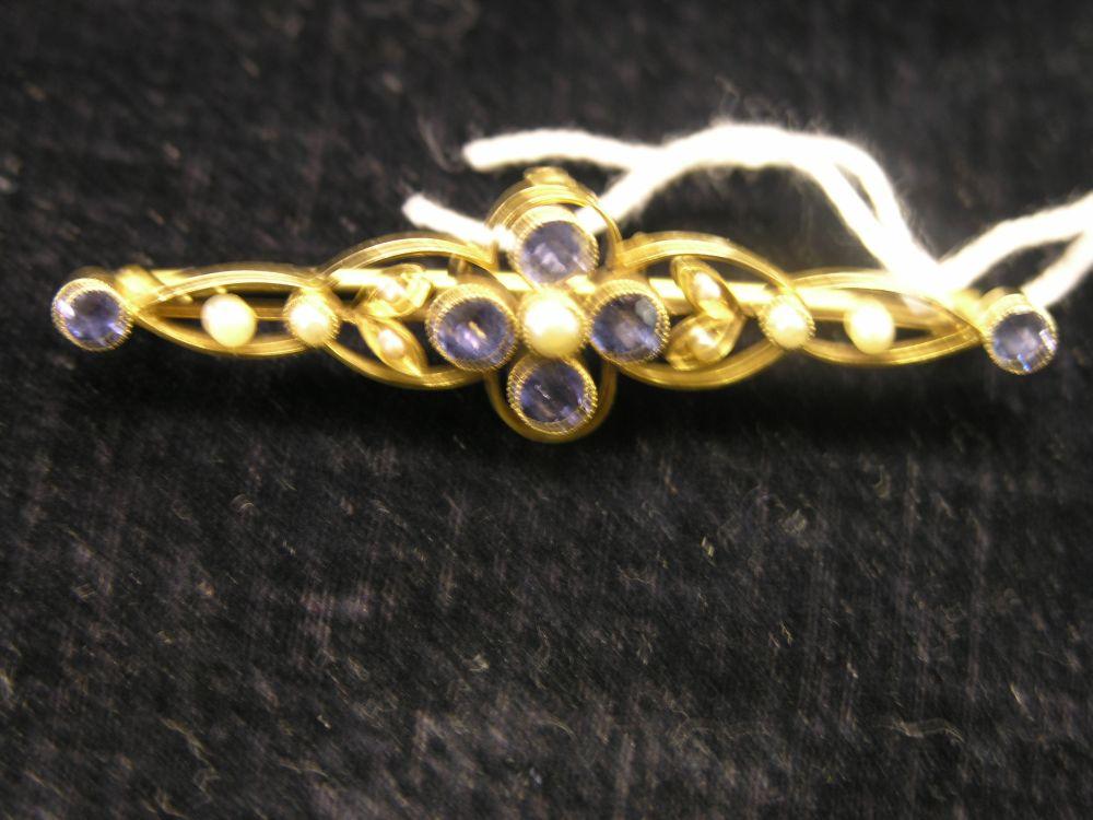 Appraisal: A yellow metal bar brooch set with blue stones and