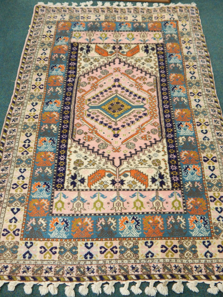 Appraisal: A modern Persian style rug with a central vivid pink