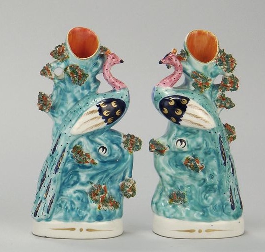 Appraisal: PAIR OF STAFFORDSHIRE PEACOCK SPILLS Circa In turquoise with pink