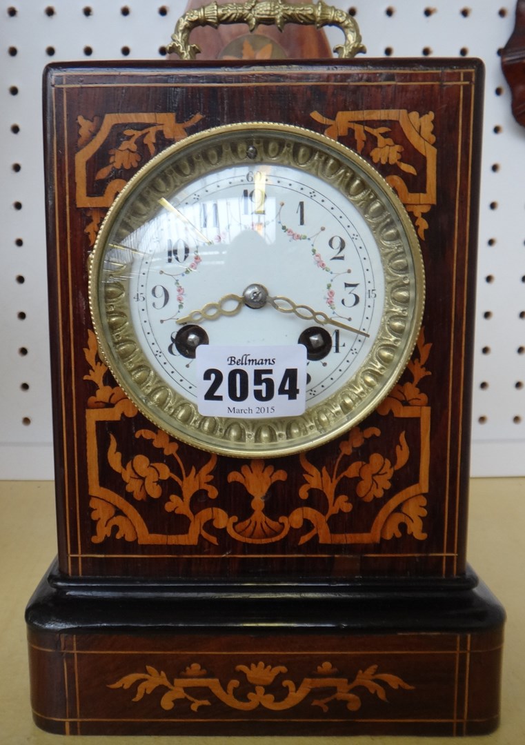 Appraisal: A rosewood and inlaid mantel clock th century with two