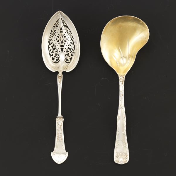 Appraisal: GOTHAM AND TIFFANY TWO SERVING SPOONS Gorham pierced serving spoon