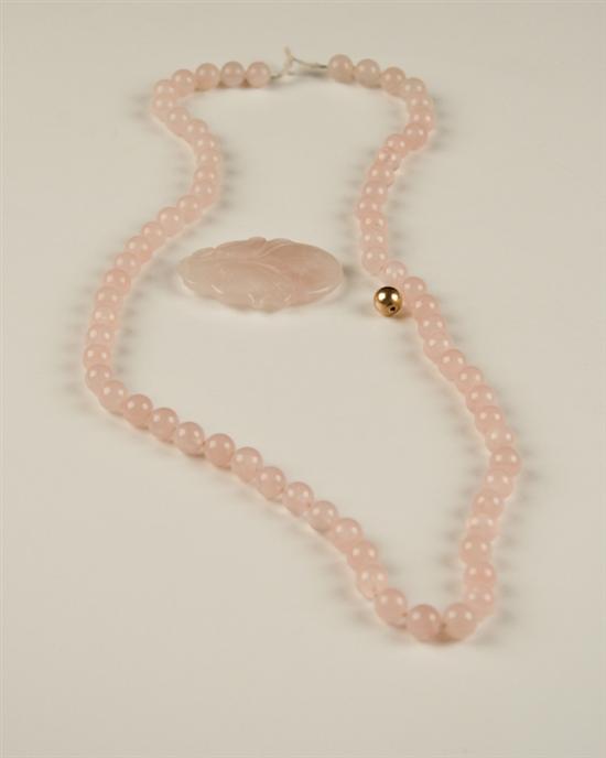 Appraisal: A Rose Quartz Bead Necklace and Pendant the pendant carved