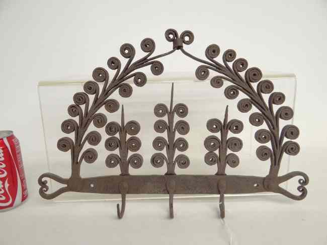 Appraisal: Fancy iron hook rack '' x ''