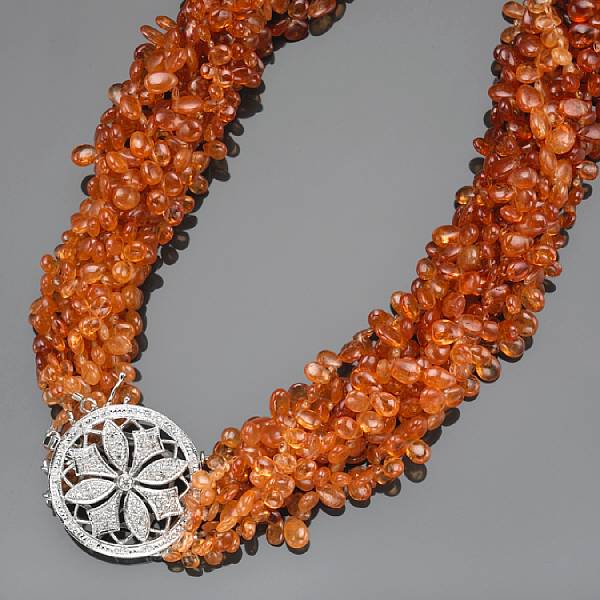 Appraisal: A spessartite garnet diamond and k white gold torsade necklace