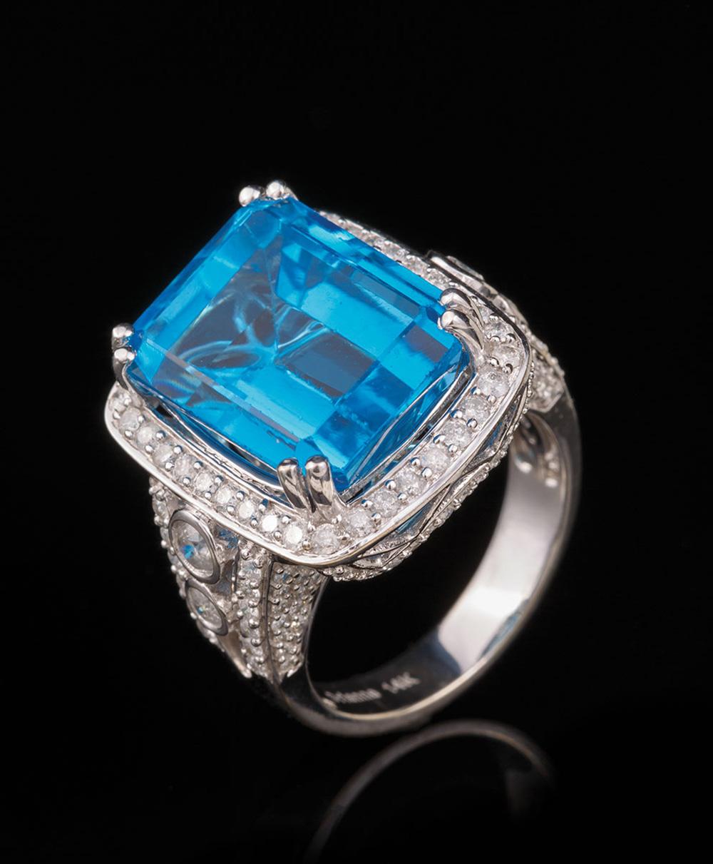 Appraisal: kt White Gold Blue Topaz and Diamond Ring center prong