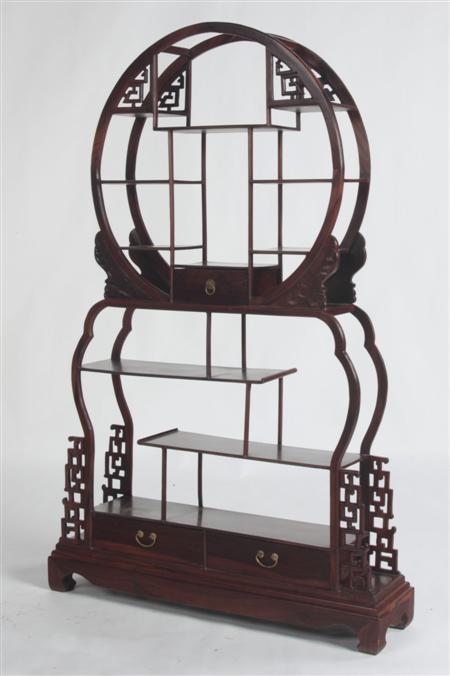 Appraisal: A Chinese rosewood collector's display stand the circular open framed