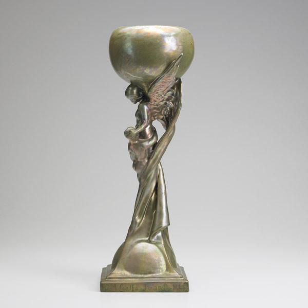 Appraisal: CLEMENT MASSIER Tall figural vessel with a man holding a