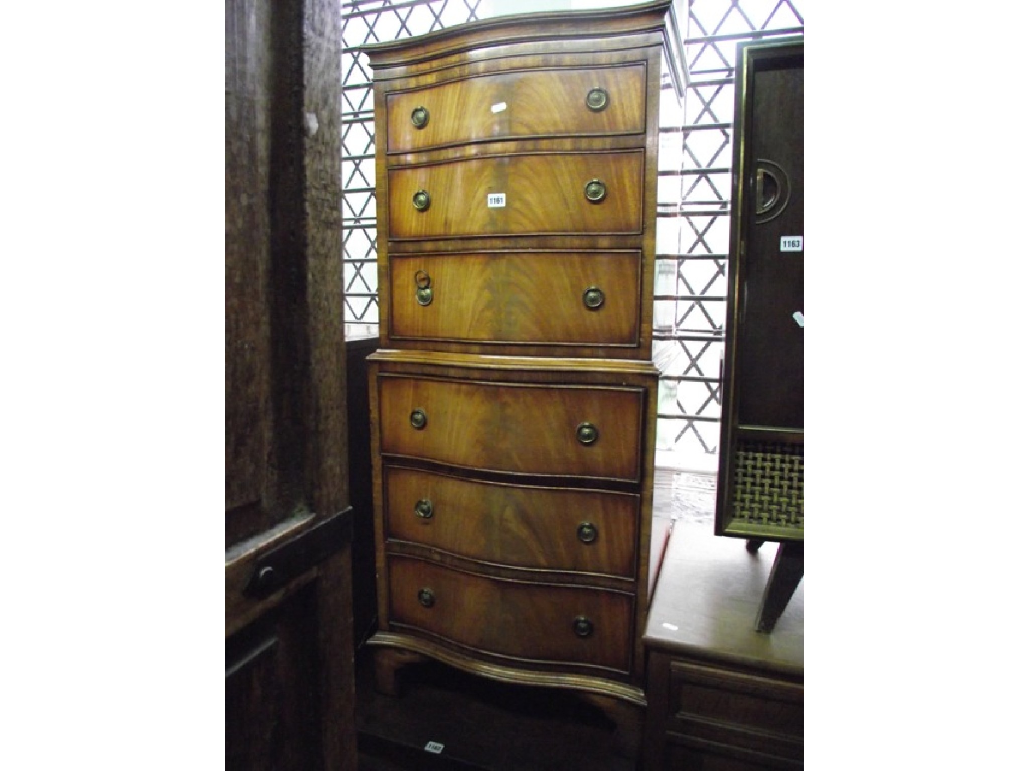 Appraisal: A small reproduction mahogany chest on chest in the Georgian