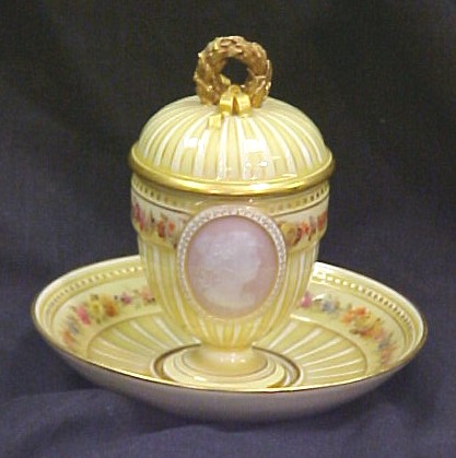 Appraisal: Meissen covered cup and saucer cover with gilt wreath finial