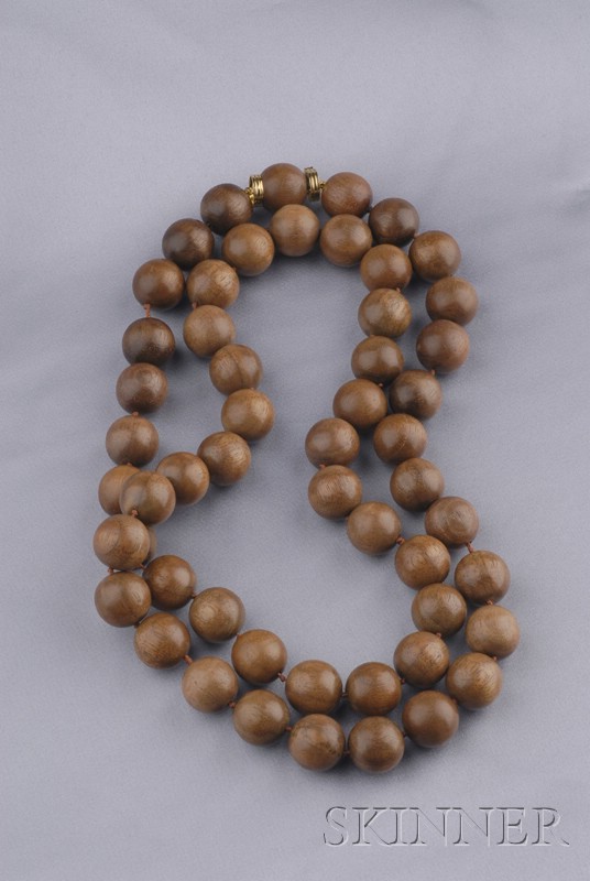 Appraisal: Walnut Bead Necklace Trianon composed of fifty-four beads each measuring