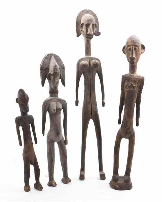 Appraisal: Four African Carved Wood Figures comprising two standing females and