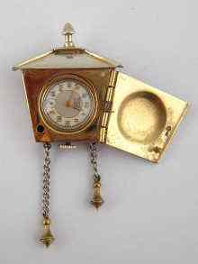 Appraisal: A white metal tests silver brooch watch designed as a