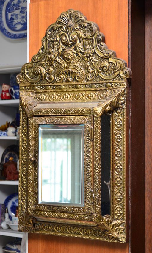 Appraisal: EMBOSSED BRASS MIRROR VALET Brass clad frame with embossed foliate