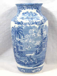 Appraisal: A blue and white vase transfer printed with Oriental scenes